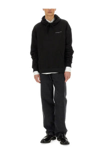 Ih nom uh nit men’s black oversized hoodie with subtle white embroidered logo on chest in soft cotton material