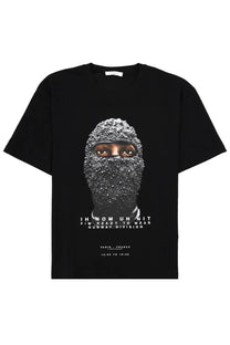 Black cotton ih nom uh nit men’s t shirt with graphic face in beaded mask and white text below
