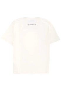 Back view of cream-colored ih nom uh nit men’s oversized t-shirt with black series limited edition print