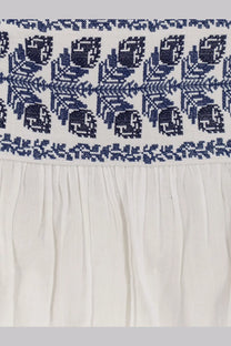 Isabel Marant Étoile white certified cotton skirt with intricate navy blue embroidered patterns along the top edge