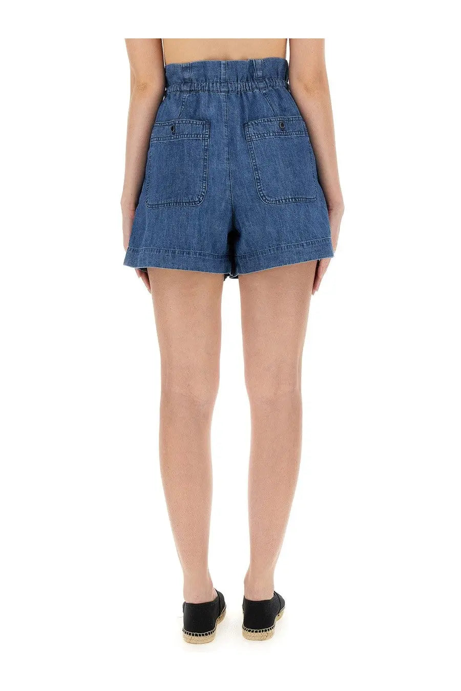 Back view of isabel marant étoile women’s high-waisted denim shorts in medium blue wash with elastic waistband and two pockets