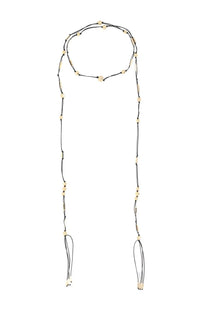 Isabel Marant women’s black bob scarf featuring a black cord necklace with cream-colored beads and tassels