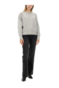 Isabel Marant women’s gray textured knit sweatshirt with subtle white logo on chest paired with black Belvira jeans
