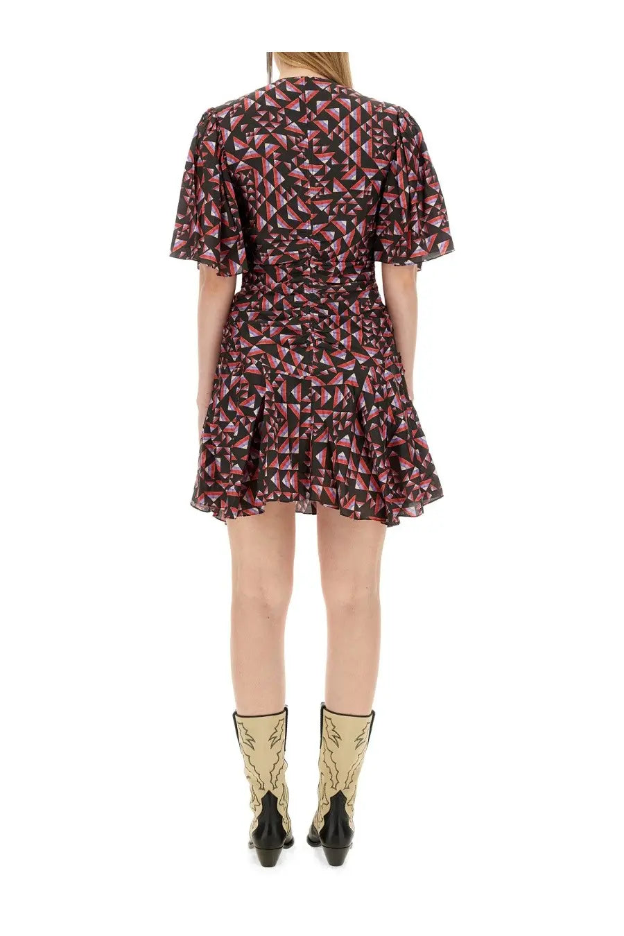 A woman wears an Isabel Marant women’s Lienne dress with puff sleeves and a pink black and white geometric pattern