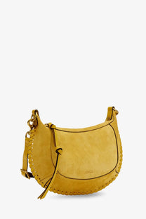 Isabel Marant women’s yellow suede crossbody bag with crescent shape braided leather strap and decorative stitching