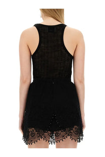 Isabel Marant women’s black lace romper with textured knit bodice and delicate floral embroidery along the hem