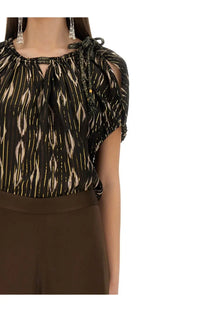 Isabel Marant women’s black blouse with gold ikat pattern and sheer ruffled sleeves tied at the shoulder