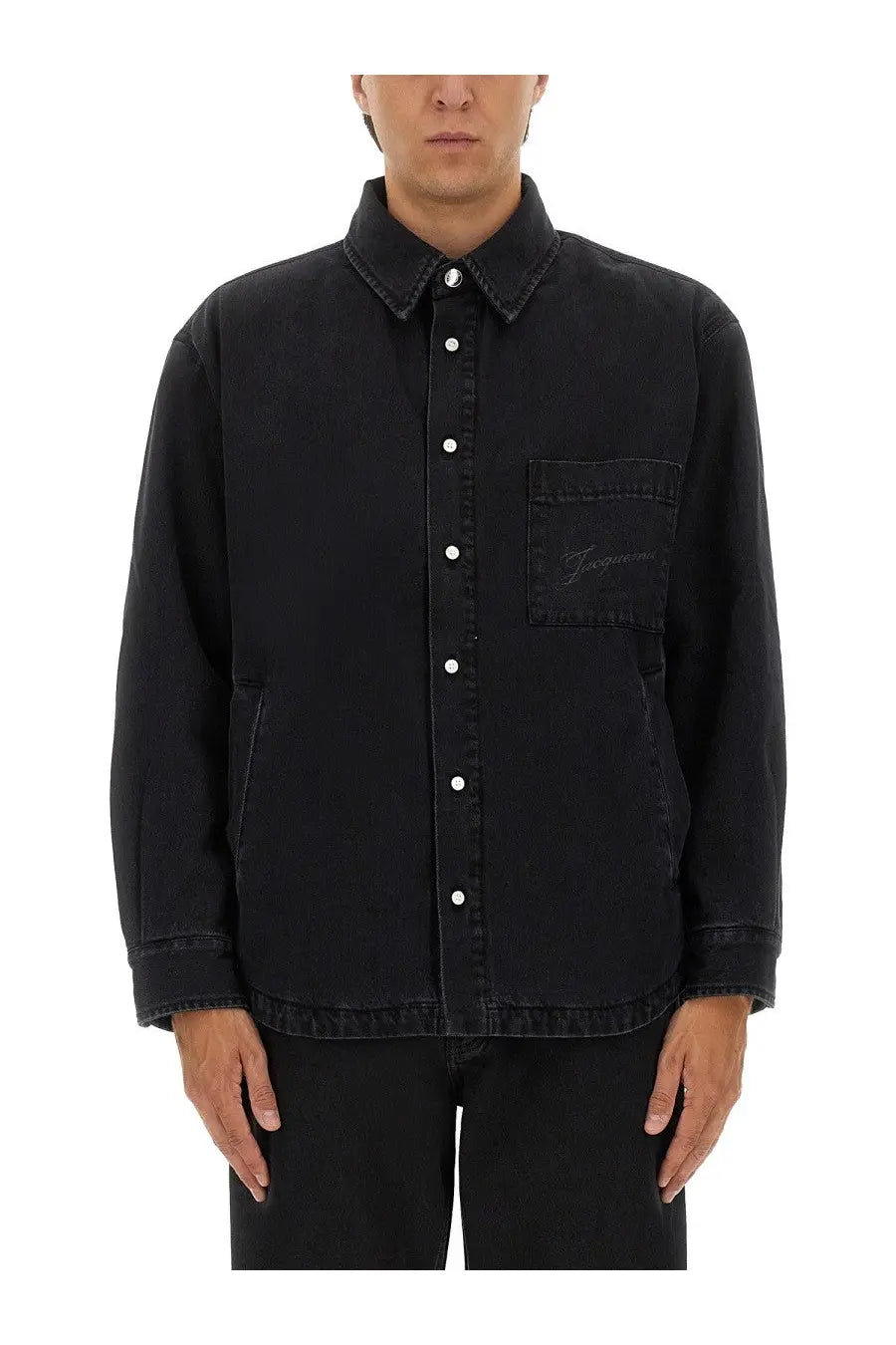 Jacquemus men’s black denim button-up shirt with subtle embroidered logo on the chest pocket