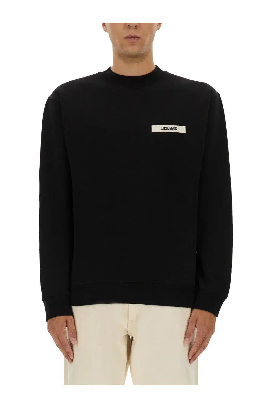 Jacquemus men’s black grosgrain crewneck sweatshirt with white rectangular label on the chest front