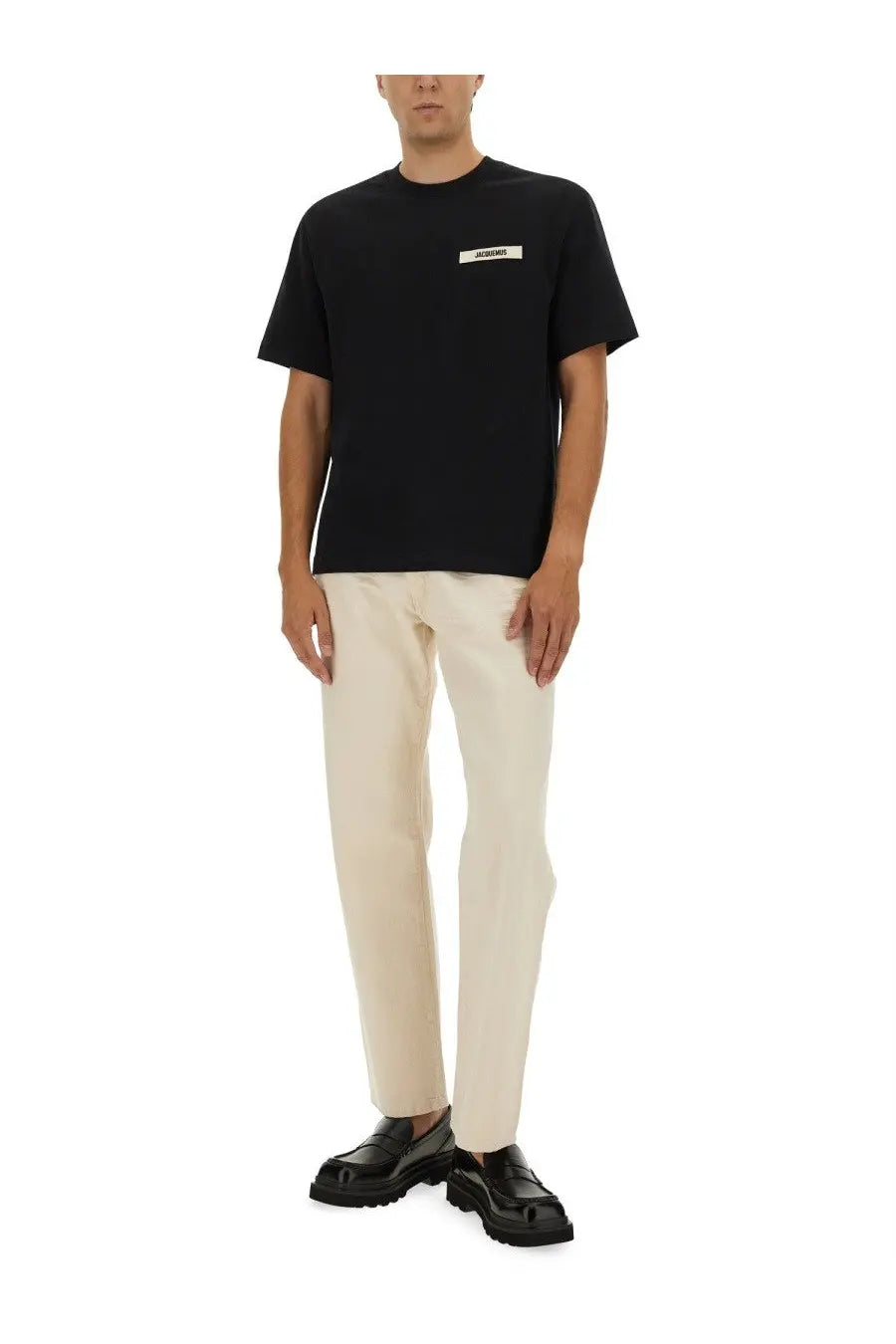 Jacquemus men’s black short-sleeved t-shirt with white gros grain rectangular label on the chest