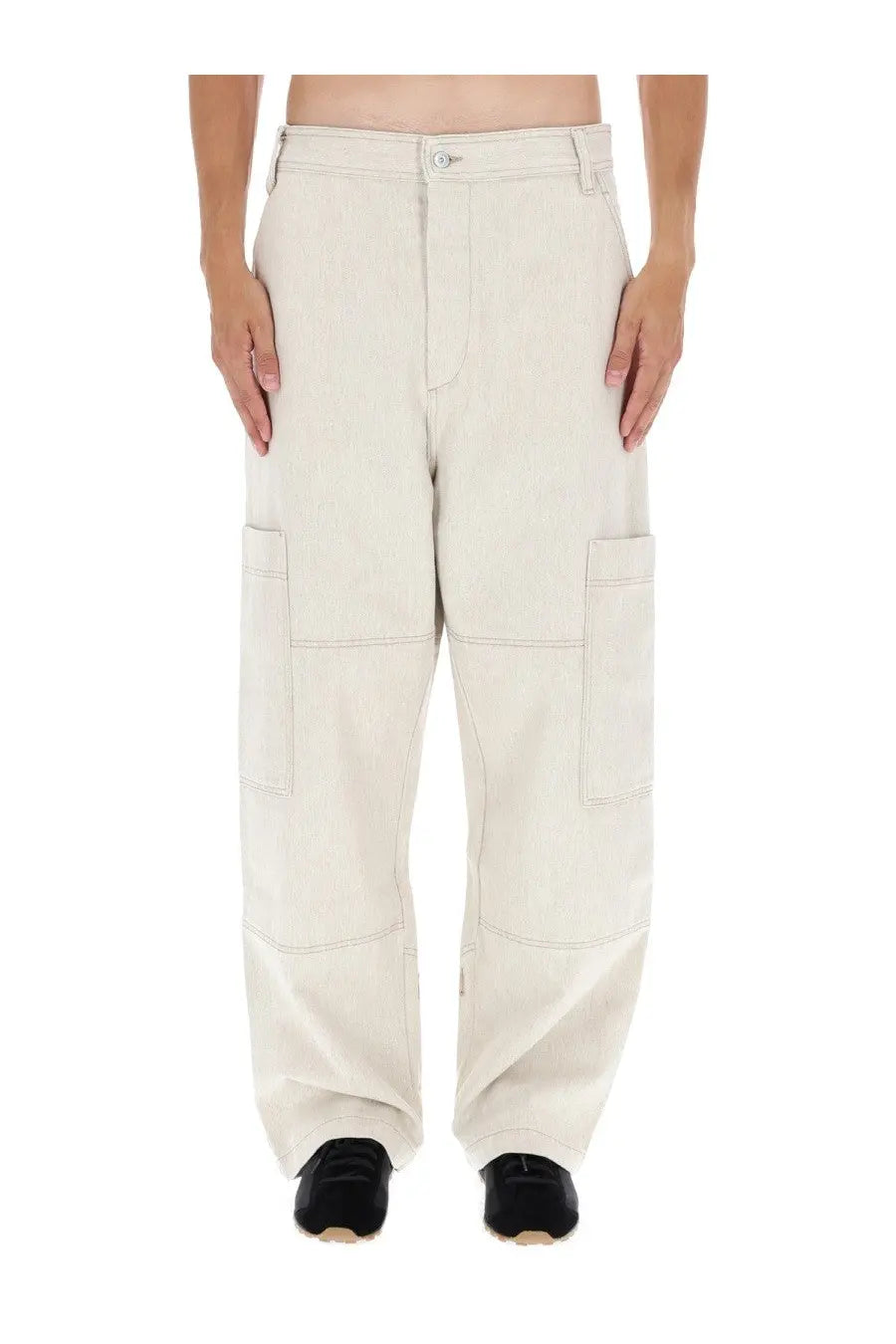Jacquemus men’s beige wide-leg cargo pants with multiple pockets and a relaxed fit in cream-colored fabric
