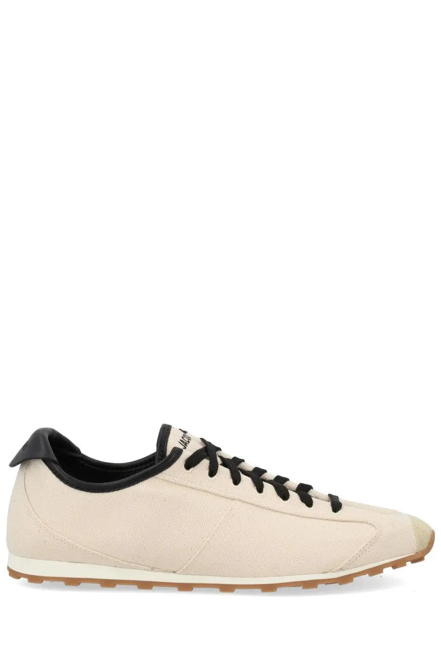 Cream-colored canvas jacquemus men’s les tennis sneaker with black laces tongue and heel tab