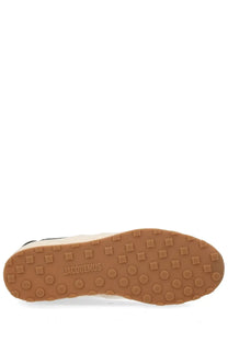 Tan rubber sole with square and circular grips embossed with jacquemus on jacquemus men’s sneaker les tennis white