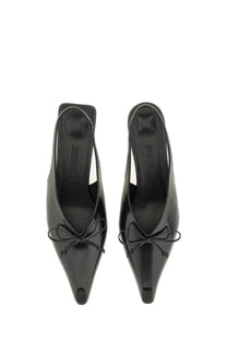 Black patent leather jacquemus the cubisto slingbacks with pointed toe and small bow at the front