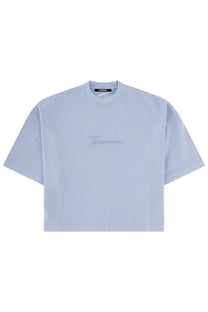 Jacquemus women’s light blue cropped t-shirt with subtle embroidered logo across the chest in pigmento blue