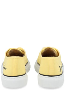Jacquemus women’s yellow canvas sneakers with white rubber soles and black stitching details