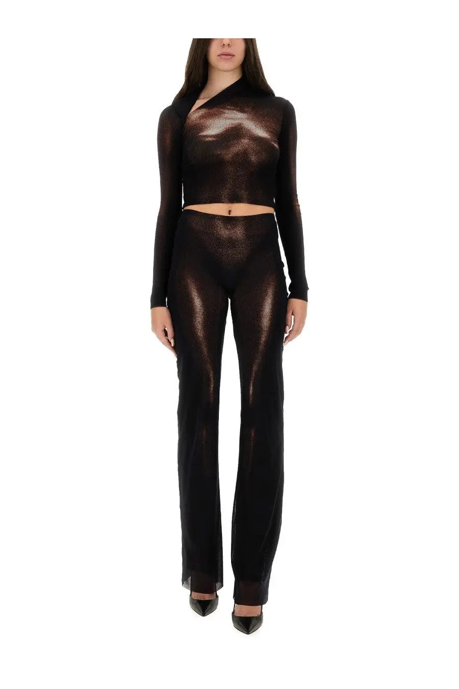 Jean paul gaultier women’s brown pants paired with a shimmering black sheer two-piece set with metallic sheen
