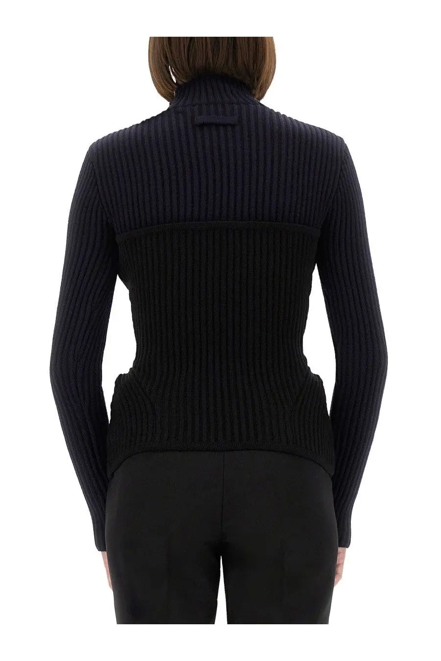 Black ribbed knit turtleneck sweater with structured tailored fit shown with jean paul gaultier women shirt blue
