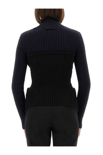 Black ribbed knit turtleneck sweater with structured tailored fit shown with jean paul gaultier women shirt blue