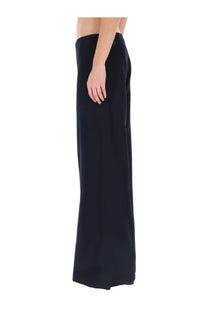 Jean Paul Gaultier women’s black wide-leg trousers with smooth flowing fabric and minimalist design front view