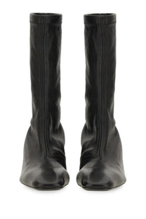 Jil Sander women’s black leather ankle boots with sleek minimalist design and square toe front view