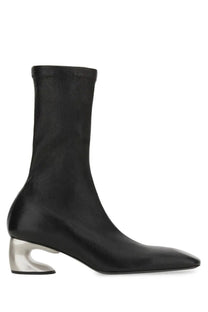 Jil sander women’s black leather ankle boot with sleek design and distinctive silver metallic block heel