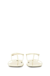Cream-colored jil sander women’s leather t-strap sandal with sleek minimalist design and smooth leather-like material