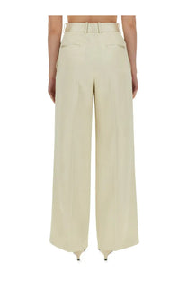 Cream-colored jil sander women’s tailored wide-leg pants with matching belt and tailored fit in white fabric