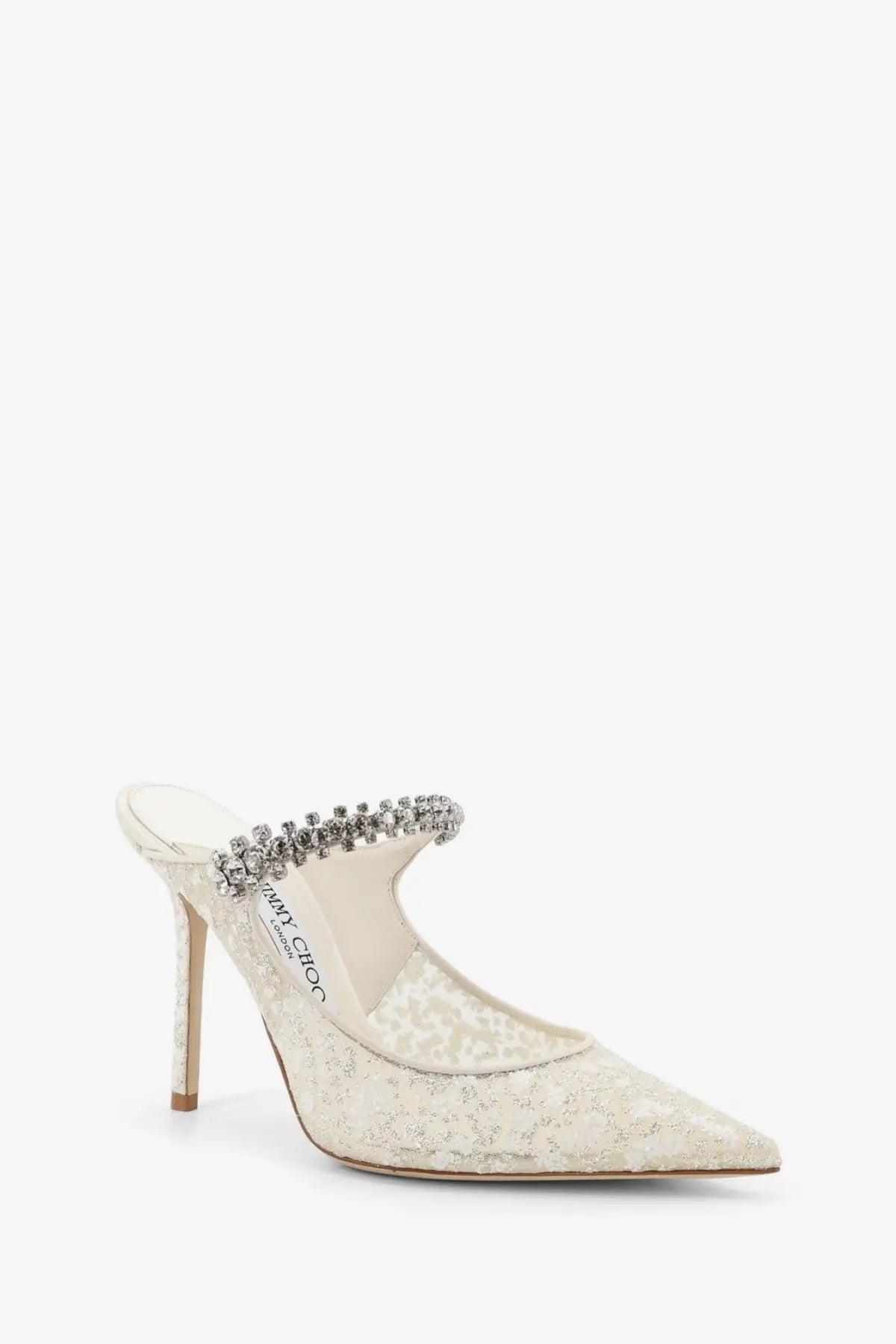Cream-colored lace mule heel by jimmy choo with sparkling crystal strap and slender stiletto heel in white tulle