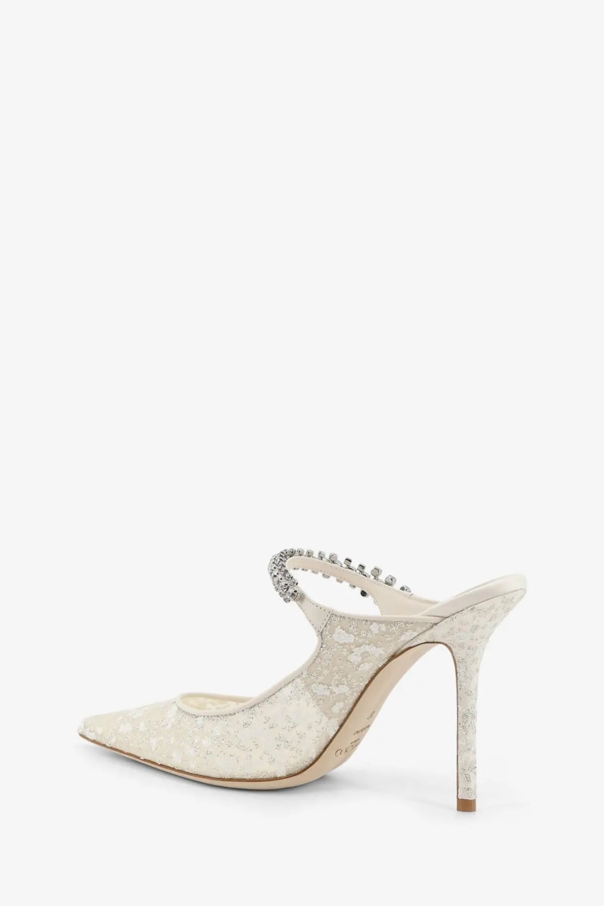 Cream-colored lace mule heel with beaded strap detail from Jimmy Choo women’s embroidered tulle écolleté white collection