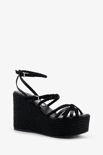 Jimmy Choo women’s Nyra black leather and raffia wedge sandals with braided strap and woven espadrille platform