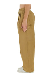 Tan wide-leg cargo pants with relaxed fit and multiple pockets from junya watanabe man and carhartt beige collection