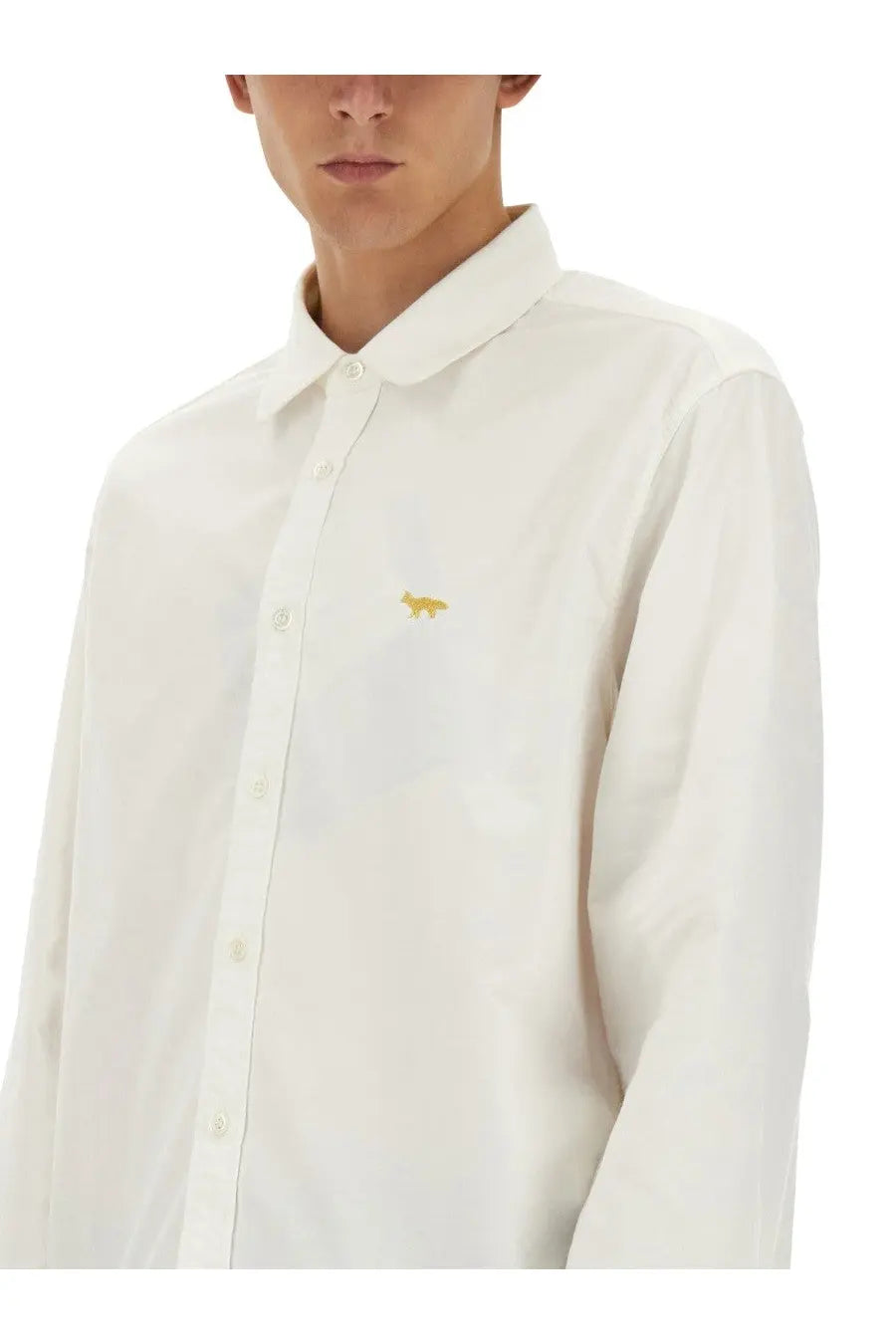 White button-down shirt by junya watanabe man with small gold fox embroidery on left chest in white fabric