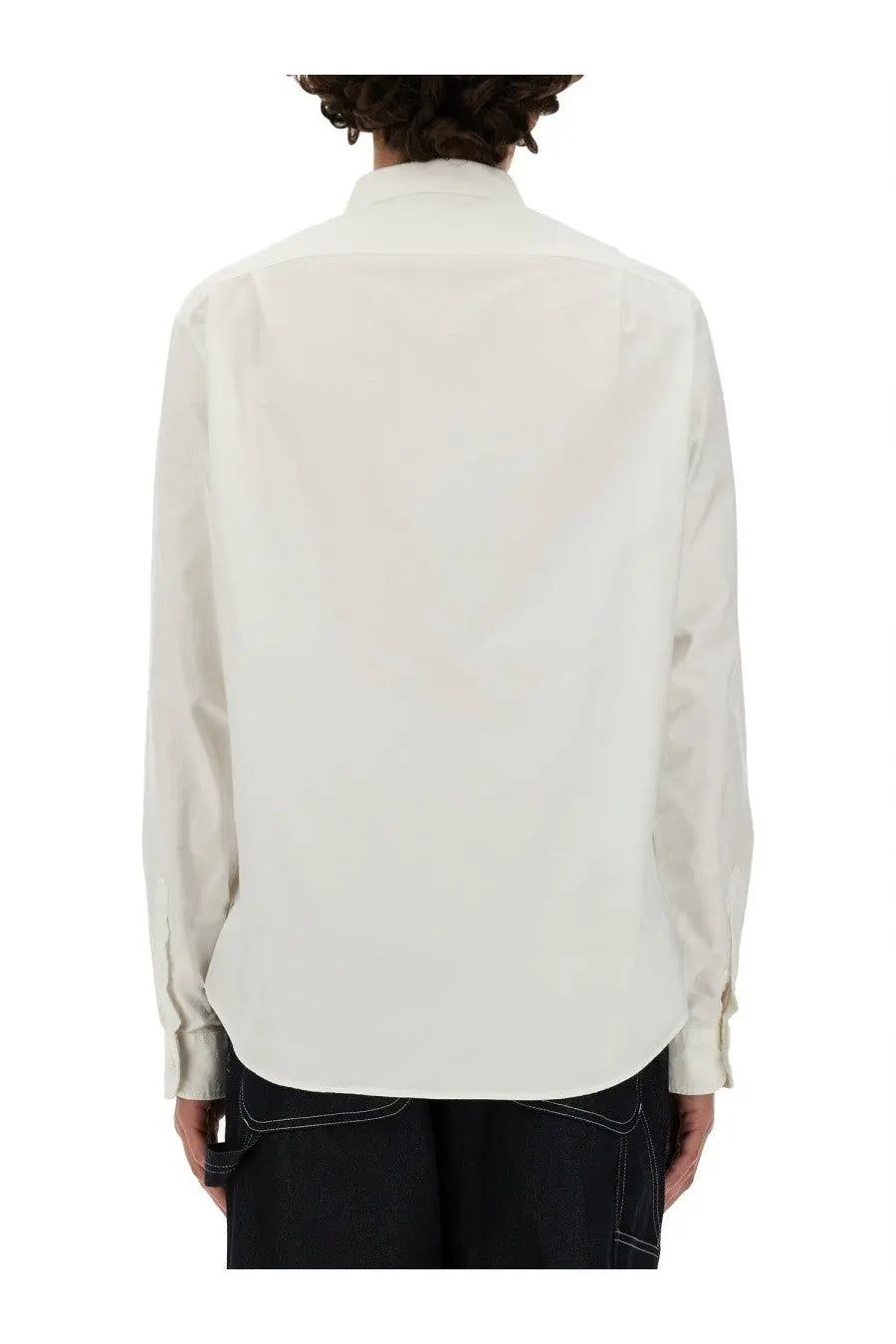 A crisp white long-sleeved button-up shirt with classic collar and folded cuffs from Junya Watanabe Man Maison Kitsune