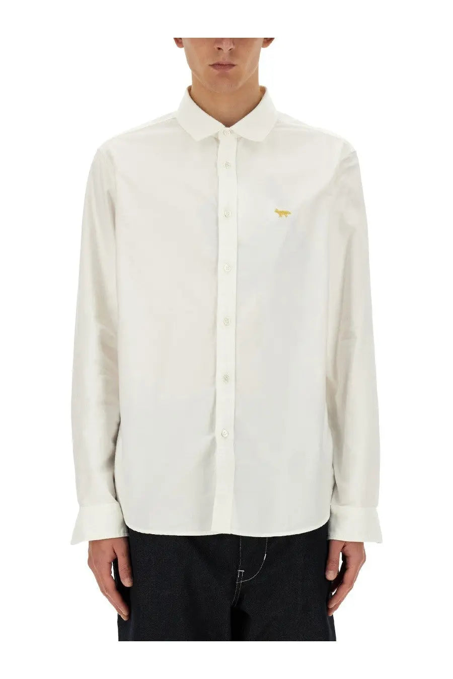 White long-sleeved button-down shirt with small gold fox embroidery on left chest by junya watanabe man maison kitsune