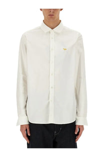 White long-sleeved button-down shirt with small gold fox embroidery on left chest by junya watanabe man maison kitsune