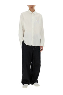 White long-sleeved button-up shirt with subtle gold logo on chest by junya watanabe man maison kitsune