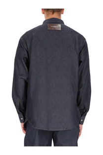 Jw anderson men’s denim shirt blue in dark indigo with a brown leather patch at the collar