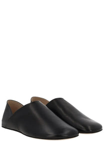 Jw anderson men’s black leather slip-on loafers with sleek minimalist design perfect for stylish casual wear