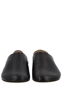 Jw anderson men’s black leather slip-on mules with a smooth minimalist design