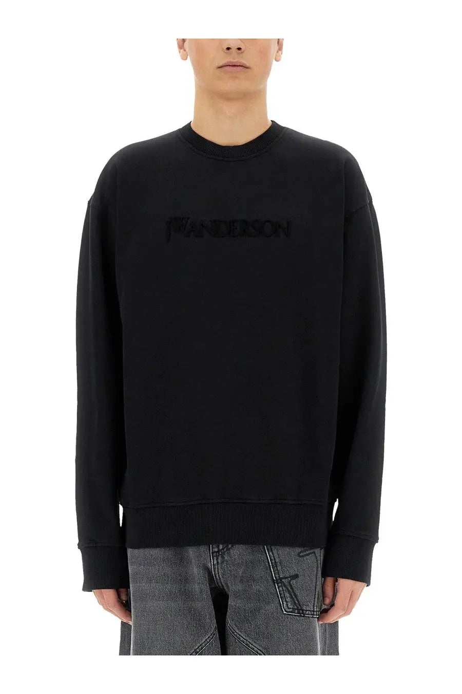 Jw anderson men’s black sweatshirt with a subtle textured logo across the chest ideal for casual wear