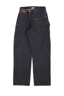 Back side of jw anderson men’s twisted workwear dark indigo denim jeans with geometric anchor embroidery and contrasting stitching