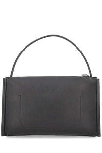 Black leather JW Anderson women’s loafer bag with minimalist design and curved top handle