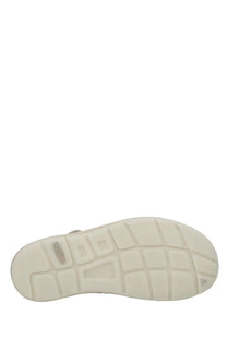 Cream-colored keen men’s sandalo uneek quite luxury beige shoe sole with textured grid-like pattern visible from the back side