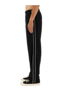 Kenzo men’s black track pants with white vertical stripes down the sides for athletic wear