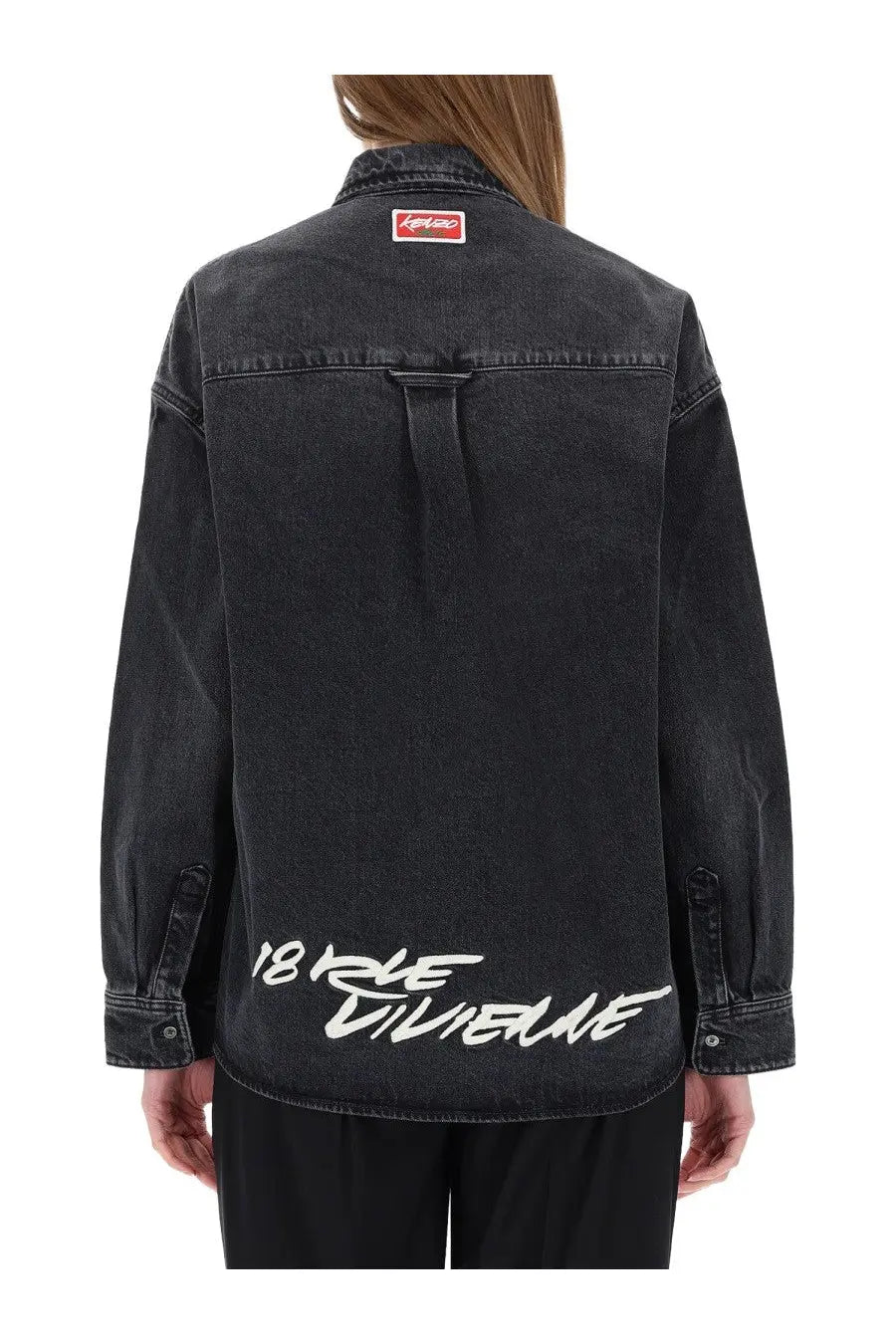Back of black kenzo women’s workwear denim jacket with white 18 rue villeneuve graffiti lettering and red collar tag