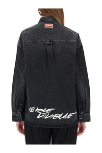Back of black kenzo women’s workwear denim jacket with white 18 rue villeneuve graffiti lettering and red collar tag