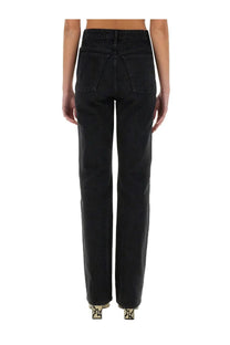 Back view of khaite women’s jeans danielle black high-waisted straight-leg denim jeans with classic back pockets