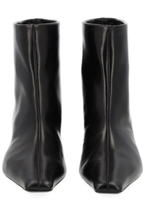 Khaite women’s Stivale Arizona black patent leather ankle boots with sleek minimalist design and pointed toe