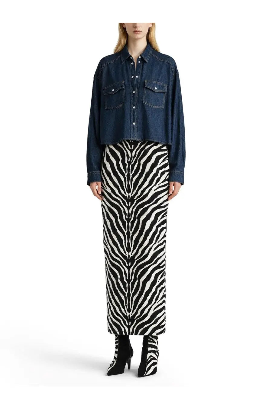 Khaite women’s top grenon blue paired with a black and white zebra-striped knit midi skirt and denim jacket with matching boots